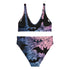 Model wearing a high-waisted pastel goth bikini set featuring a black bat and spiderweb print over an ombré pink and purple background. The two-piece swimsuit includes a scoop neck top and high-rise bottoms, styled outdoors in bright festival and poolside settings. Made of recycled fabric, soft, stretchy, and UV resistant. Available in XS to 3X. Aesthetic is gothic, spooky cute, and Y2K inspired.